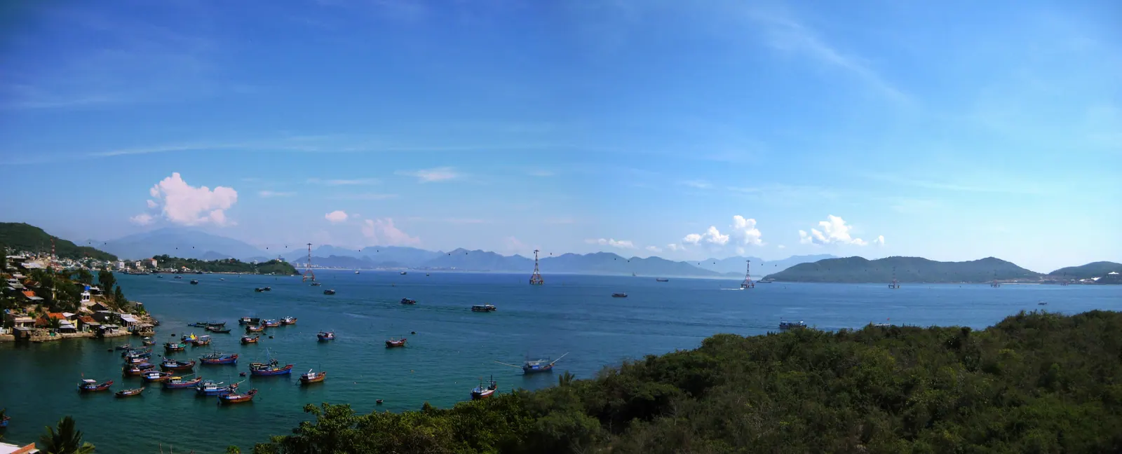 The Nha Trang coastline seen from the air, with the beach curving along the bay.
