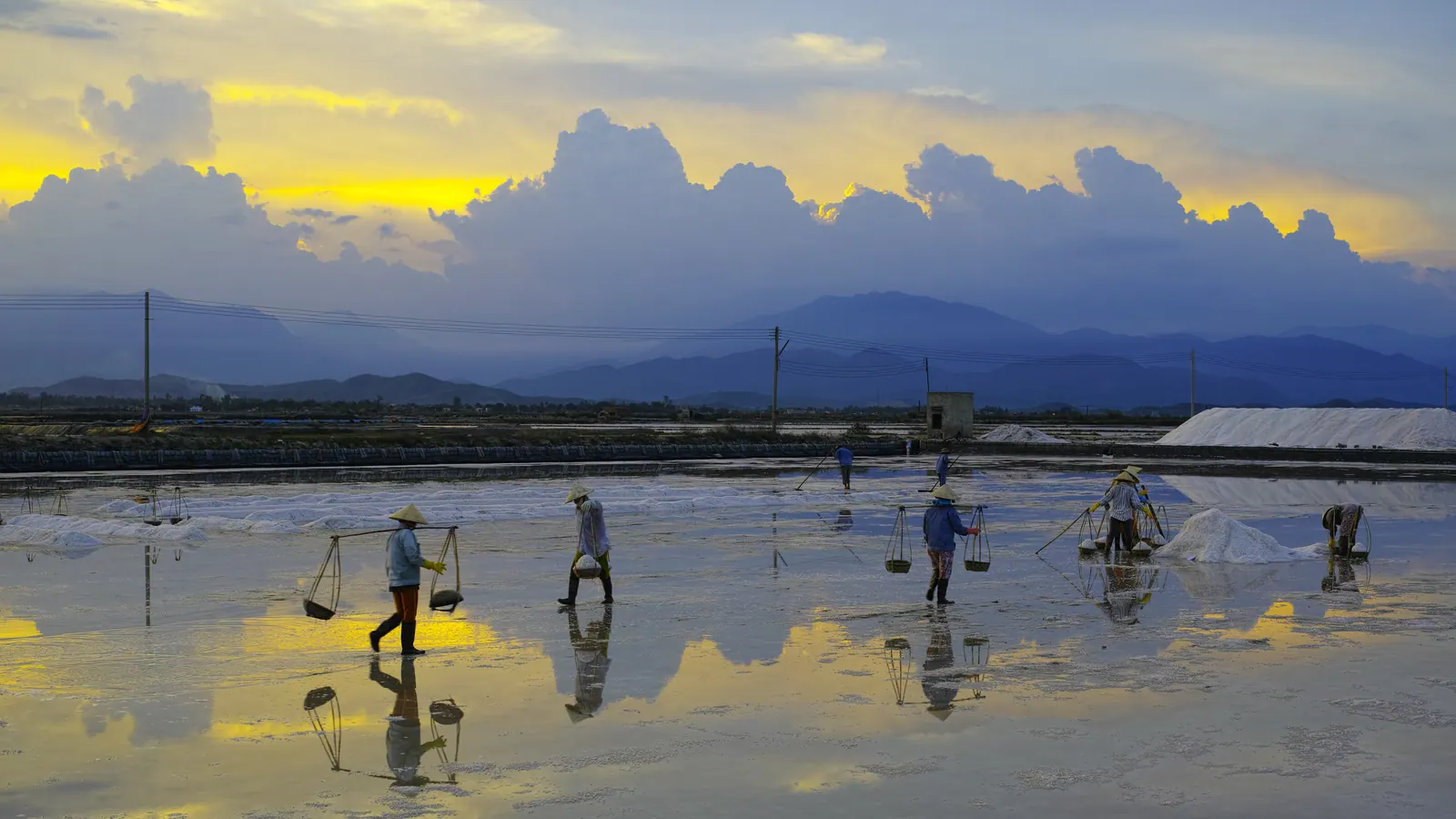 Geometric salt pans with heaped white crystals in Khanh Hoa; this photograph is from the Hon Khoi fields near Ninh Hoa, not from Cam Ranh